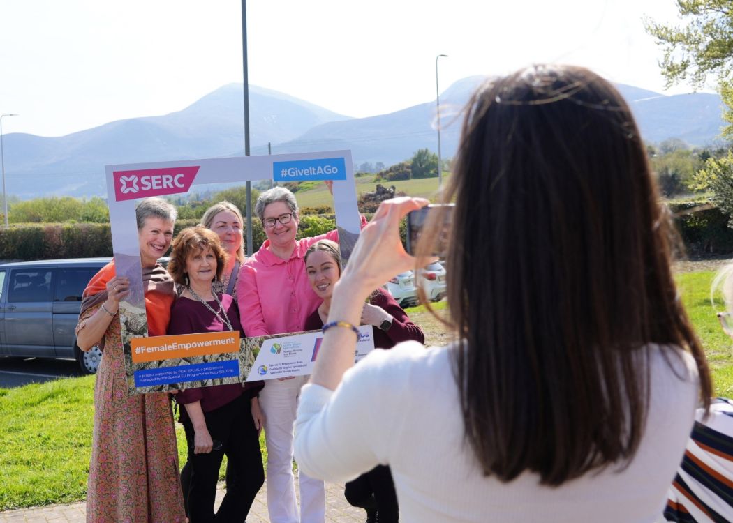 Participants at the conference pose for photos